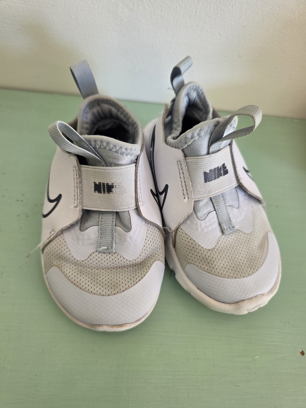 Nike Kids Slip-On Sneakers in Light Gray and White with Black Swoosh